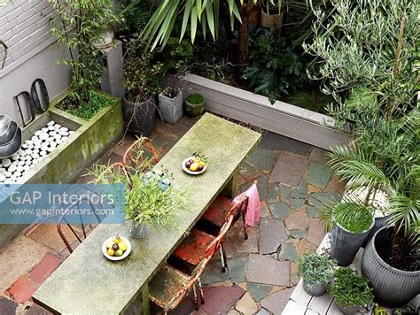 Our collection of tables come in a multitude of sizes, finishes and expressions, making them an ideal fit for dining settings and home offices alike. GAP Interiors - Exterior table and chairs - Image No ...