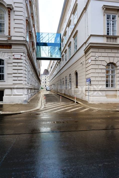 Modern Glass Walkway Between Two Buildings As Seen From The Street