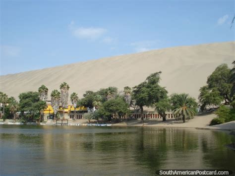 The Huacachina Lagoon With Huge Sand Dunes Behind Photo From Peru