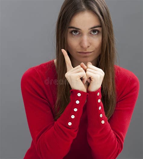 Quiet Young Woman Raising Her Finger For Expressing Her Disappointment