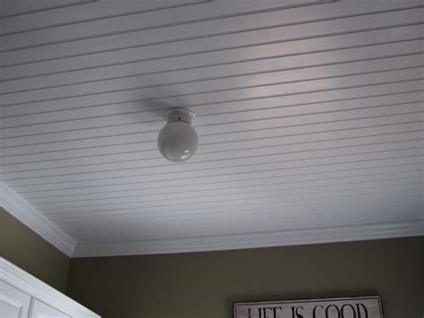 Above it is a painted faux reflection that draws the eye to the fixture. How to Paint a Beadboard Ceiling - Calypso in the Country