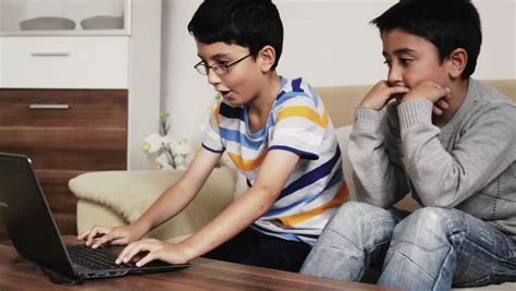 You can take turns trading off, taking timed turns, etc, with the winner winning best two out of three, or whatever rules. 2 Kids Who Are Friends And Brothers Having Fun Playing On ...