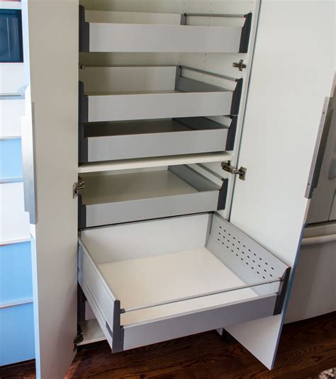 Custom pull out kitchen shelves to make your life easier. IKEA Akurum high cabinet hack with sliding shelves. Slide ...