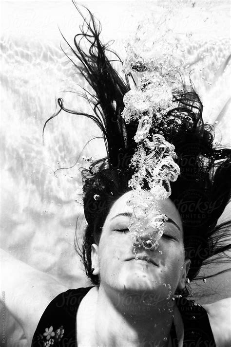 Underwater Portrait Of Woman In Dress Releasing Bubbles By Stocksy Contributor Boris