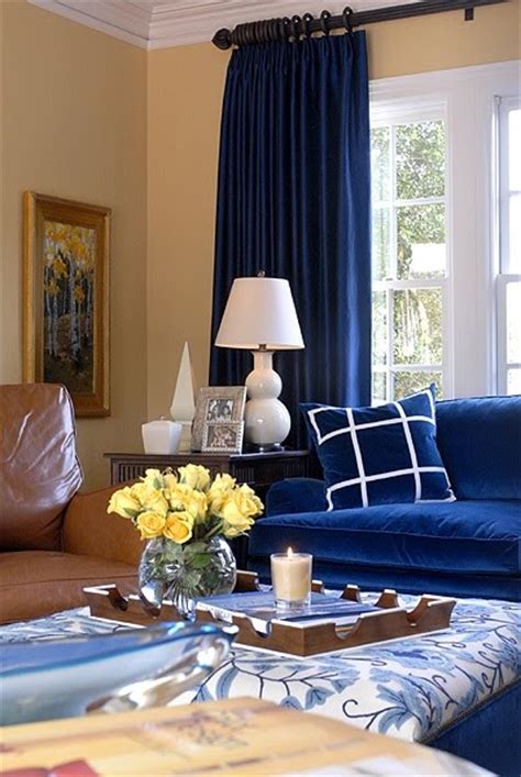 In this blue living room designed by studio db, the peach and marigold throws add just the right amount of variance. 25 Blue Room Design Ideas - Shelterness