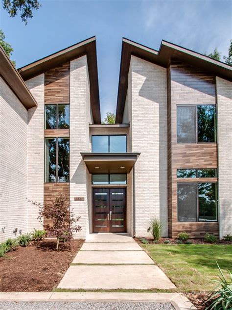 From this point of view, there are two windows and two doors, one door providing an entrance way into the house itself and the other offering entrance into the single car garage. Double front doors, Exterior homes and Modern exterior on ...