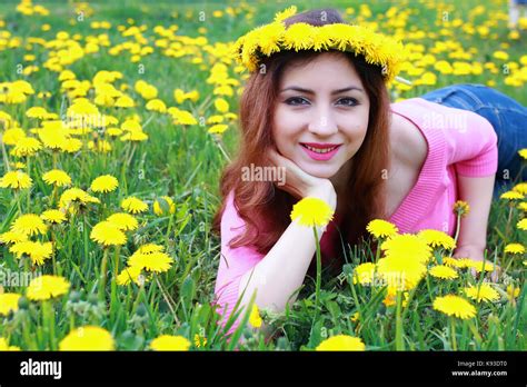 Young Woman On Dandelion Meadow Stock Photo Alamy