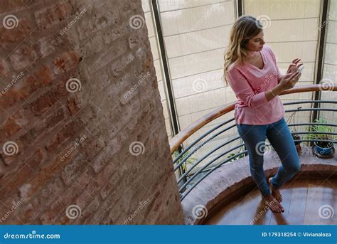 Caucasian Woman Barefoot With Cell Phone In House Stock Photo Image