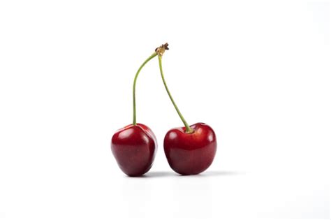 Red And Black Cherries On White Background Free Photo