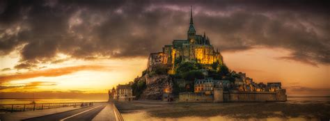 Green Concrete Castle Near Road Under White Cloudy Sky During Yellow