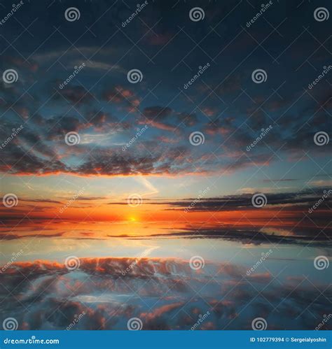 Beautiful Sunset Over The Ocean With Dramatic Autumn Sky Stock Photo