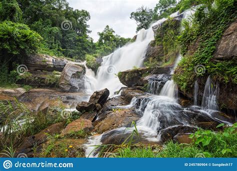 Landscape Of Peaceful Waterfall In The Tropical Rainforest Stock Photo