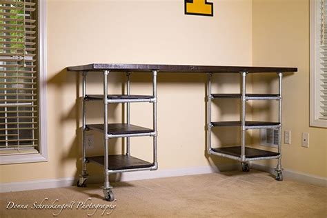 Made from black iron pipe and two recycled glass insulators. Industrial Pipe Desk & Shelving Plans | Simplified Building