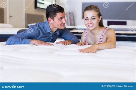 Married Couple Choosing New Mattress Stock Image Image Of Couple Friends 179670739