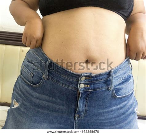 Overweight Woman Trying Fasten Her Blue Stock Photo 692268670