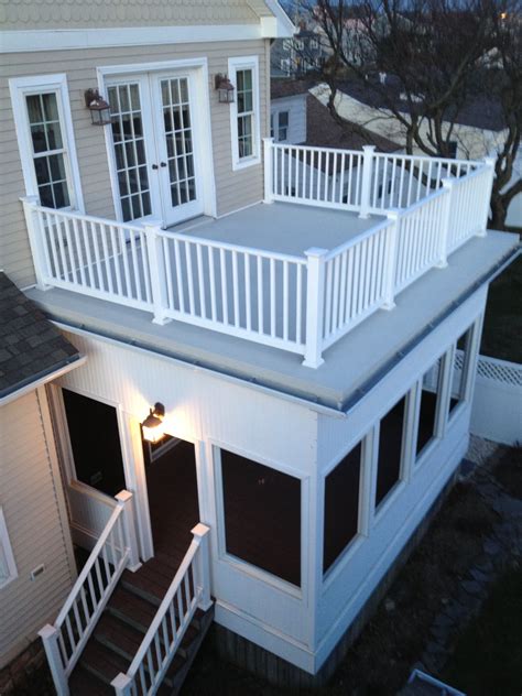 Maybe you would like to learn more about one of these? Flat roof with railings and a screened in porch. Wife can ...