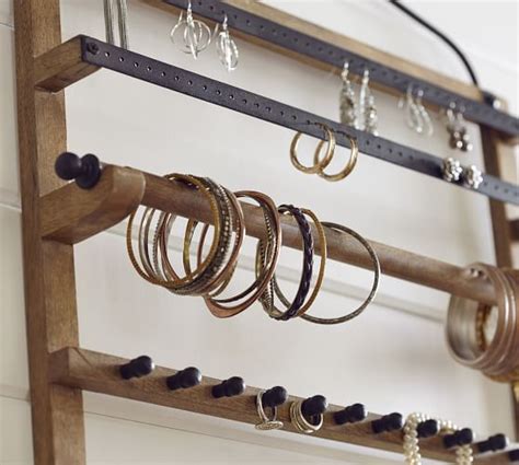 So essentially, it's free shipping to a local store. Wall-Mounted Mango Wood Jewelry Organizer | Pottery Barn