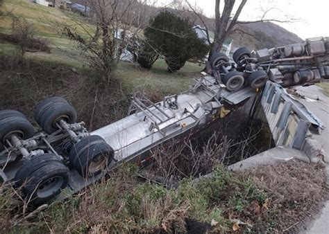 Driver Survives Crash That Leaves Semi Hanging Off Kentucky Bridge