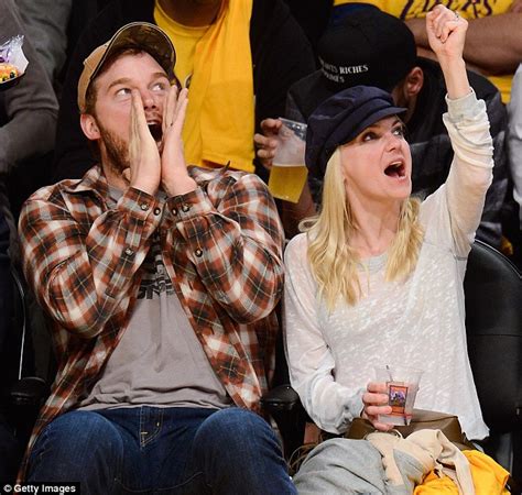 She's already at rock bottom. Chris Pratt and Anna Faris cuddle up as they cheer on the ...