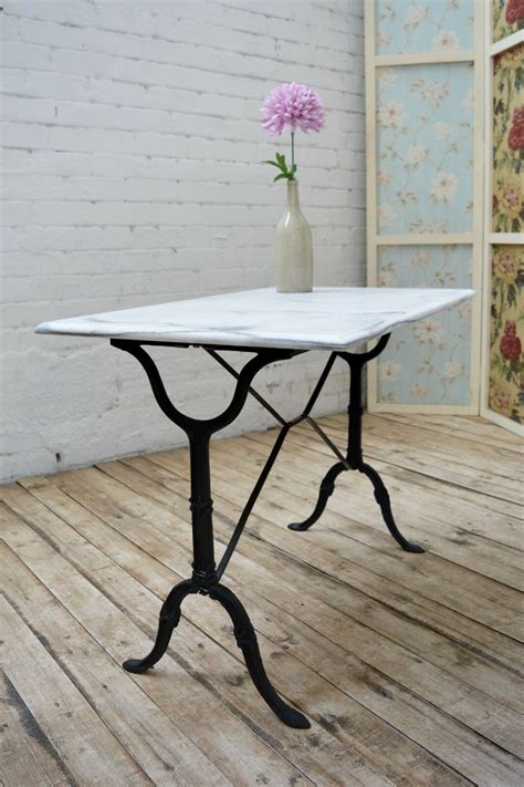 Aesthetic french country style kitchen cabinets made of wooden materials finished in creams. French Vintage Cast Iron Marble Bistro Table / Kitchen or ...