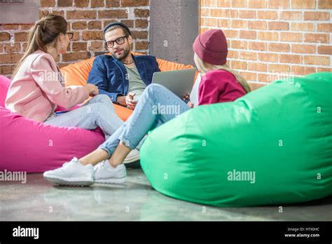 People In Bean Bag Chairs Stock Photo Alamy