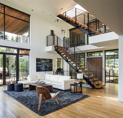Double Height Living Area With Metal Staircase In A Residence Designed