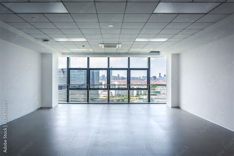 interior empty office room with white wallpaper without furniture in a new building big space