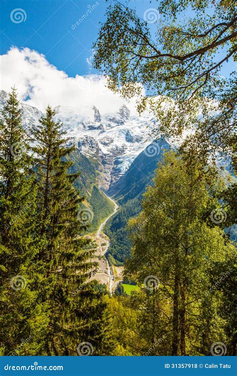 Snow Covered Mountains And Rocky Peaks In The French Alps Stock Photo