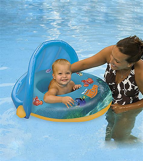 Swimways infant baby spring float with adjustable sun canopy (styles may vary). SwimWays Finding Nemo Sun Canopy Baby Float at SwimOutlet.com