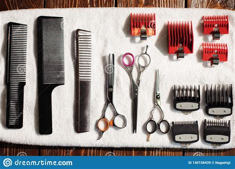 Hairdressing Tools On A Towel Scissors Combs Clipper Stock Image