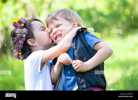 Little Girl Kissing A Little Boy Stock Photo Alamy