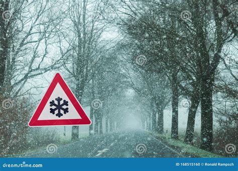 Traffic Sign Caution Snowfall Slippery Due To Snow Stock Photo Image