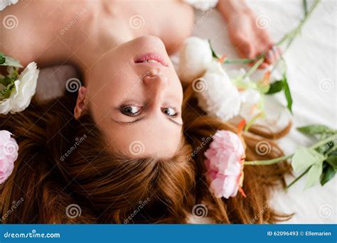 Girl With Flowers On Red Hair Lying In The Bed Stock Image Image Of