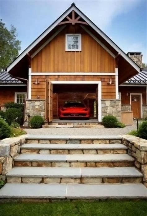 A Red Car Is Parked In Front Of A Garage With Steps Leading Up To It
