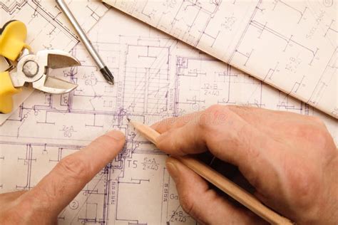 Reviewing Technical Drawings Stock Photo Image Of Tilted Single