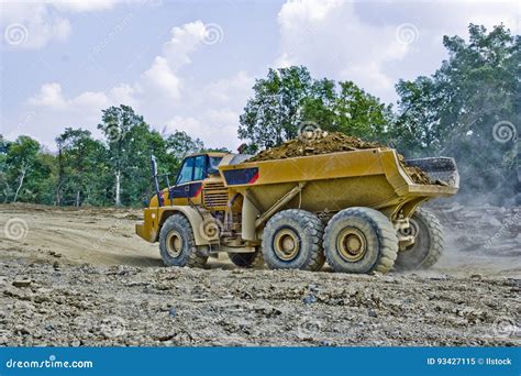 Heavy Equipment Hauling Dirt Stock Image - Image of haul, caterpillar