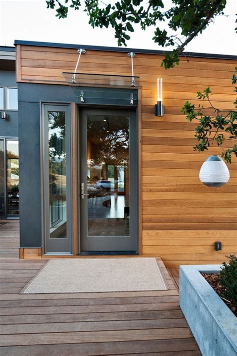 This modern front door design differs from the others thanks to the golden trimming of the window pane. 17 Best images about Glass Door Canopy on Pinterest ...