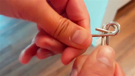 A detailed guide to solving the famous double m metal ring puzzle. P Shaped Metal Ring Puzzle Solution - YouTube