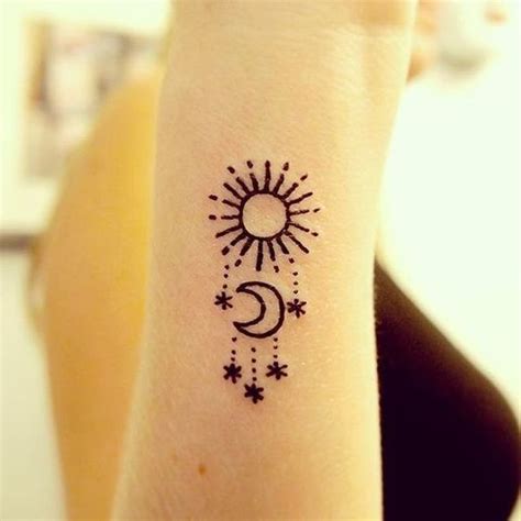 This is a very small sun tattoo design with the moon but looking so cute. Moon Tattoos With Meaning - Crescent Moon Tattoo