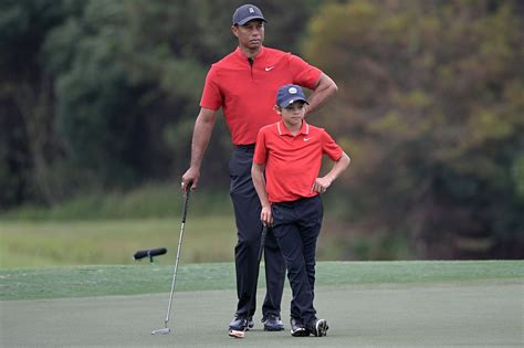 Tiger Woods Gives Son Charlie Big Hug After Showing Off Twinning