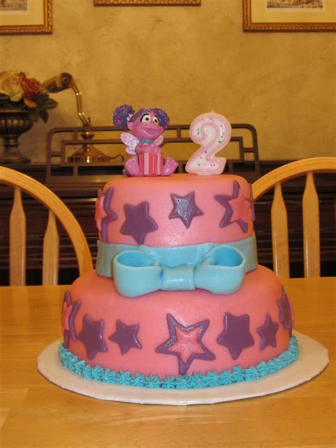 Abby Cadabby Cake Cake Covered In Fondant Blue Buttercream Star Tip Border Figure Is A Candle