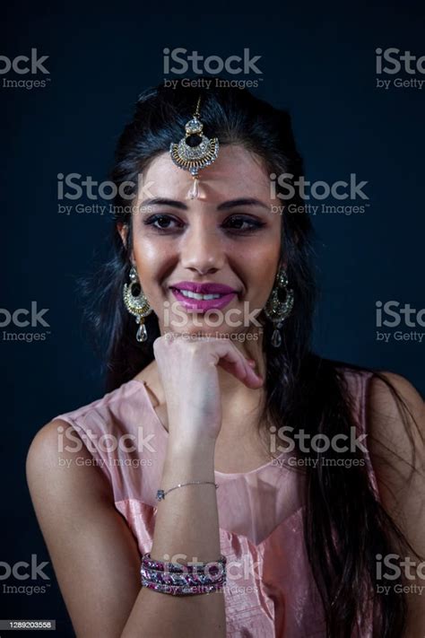 Portrait Of Smiling Beautiful Indian Girl Stock Photo Download Image
