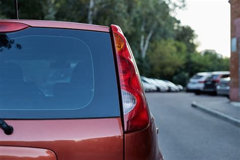 Free opel corsa hatchback car mockup (psd). Premium Photo | Back window of red car parked on the ...