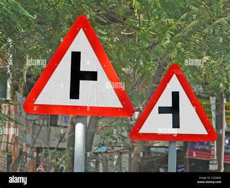Road Signboards Showing Side Roads Ahead To Right And Left Stock Photo