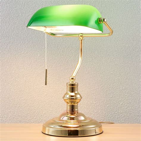 Black articulating desk lamp with power outlet. Milenka bankers lamp, polished brass | Lights.co.uk