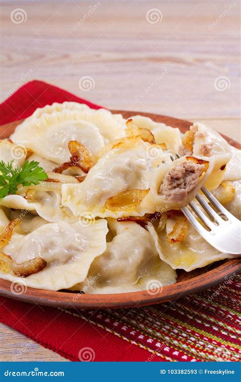 Dumplings Filled With Meat And Served With Salty Caramelized Onion