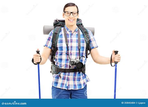 Smiling Hiker With Backpack And Hiking Poles Posing Stock Photo Image