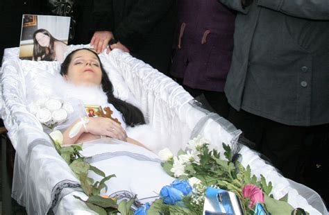 Preparing a dead body in the casket. Deformutilation: Women in Caskets Part III