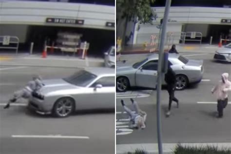 Lapd Shows Footage Of Woman Rammed By Car As She Tries To Flee Robbery