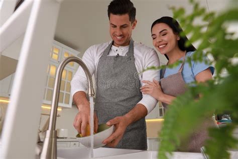 Happy Lovely Couple Washing Dishes In Kitchen Stock Image Image Of